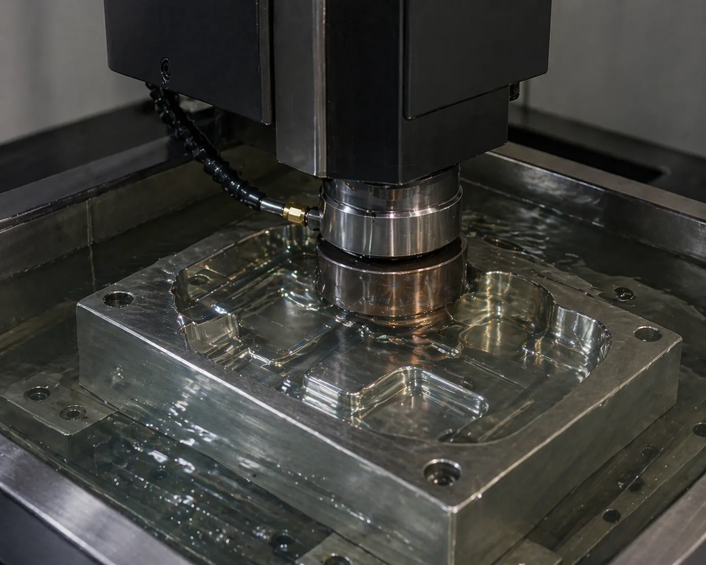 Close-up of machined metal cavities with a fine surface finish